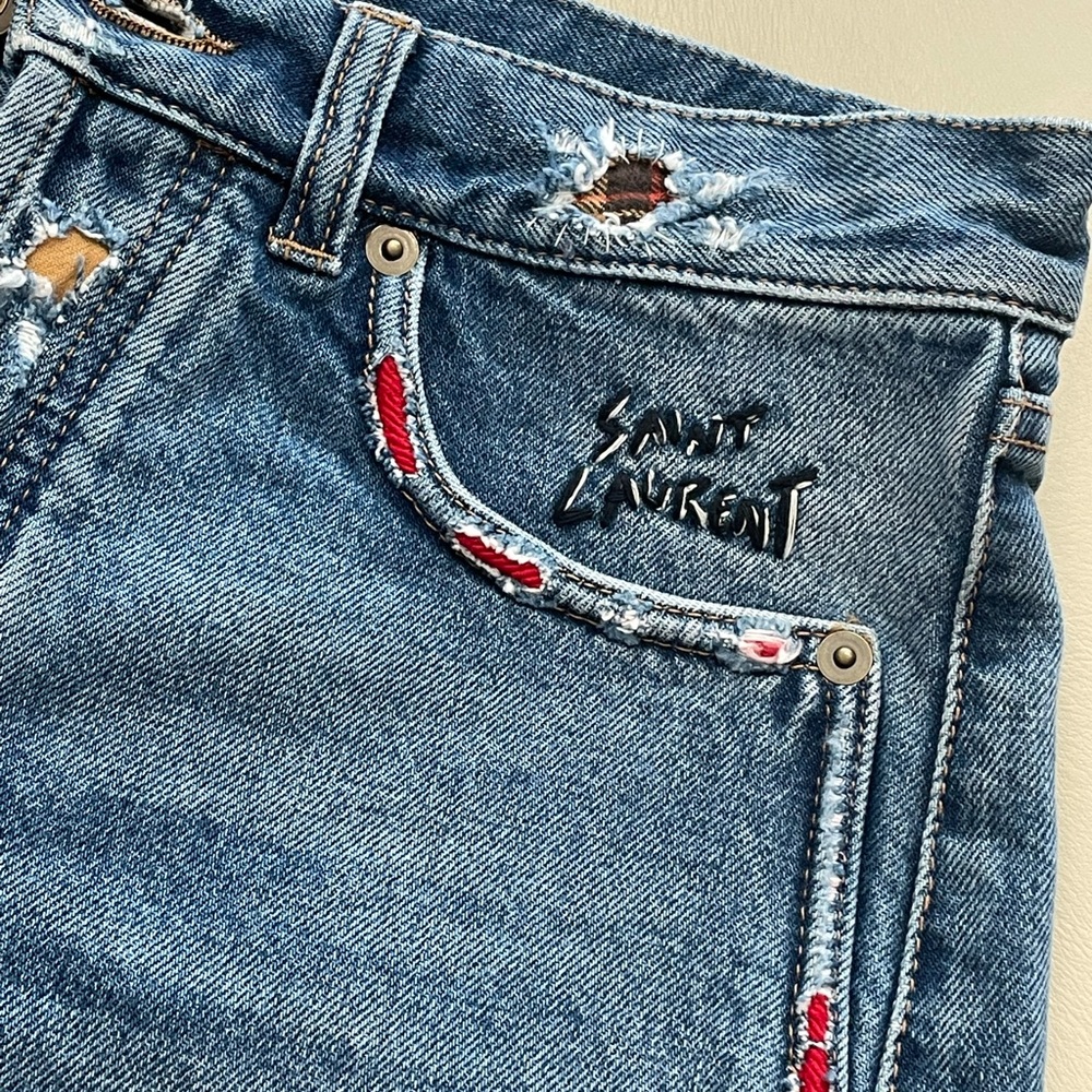 Saint Laurent embroidered jean shorts.